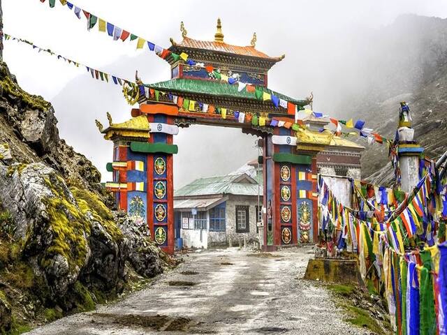 The colourful Tawang gate with prayer flags